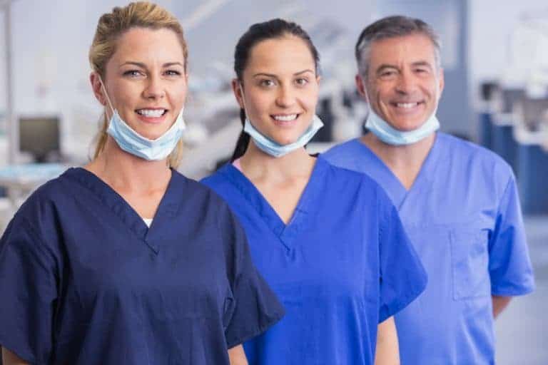 Portrait of smiling co-workers standing in a line